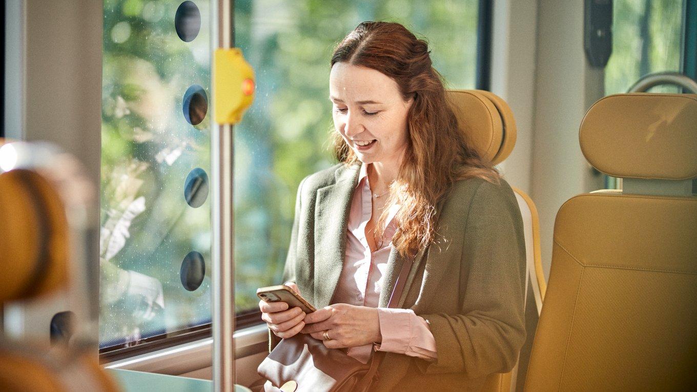 Woman travelling by light rail.